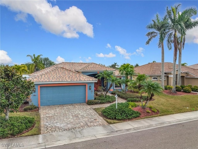 view of front of property with a garage