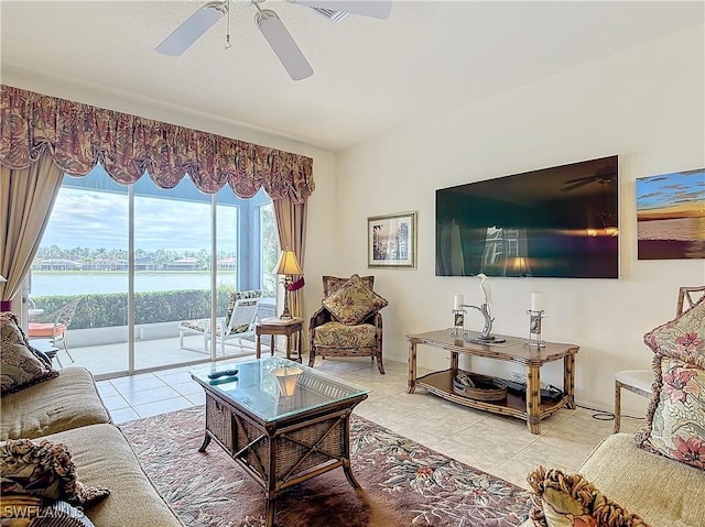 living room with light tile patterned floors and ceiling fan