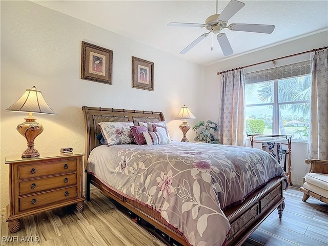 bedroom featuring hardwood / wood-style flooring and ceiling fan