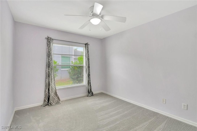 carpeted empty room with ceiling fan