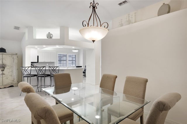 dining space featuring visible vents