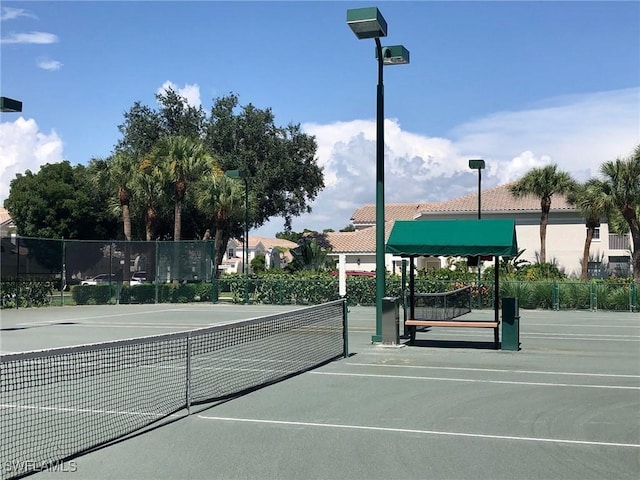 view of sport court with fence