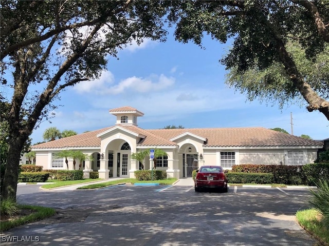 view of property with uncovered parking