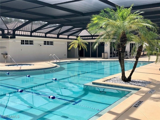 community pool with glass enclosure and a community hot tub