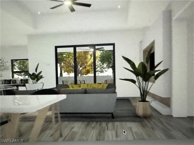 living area featuring wood finished floors and ceiling fan