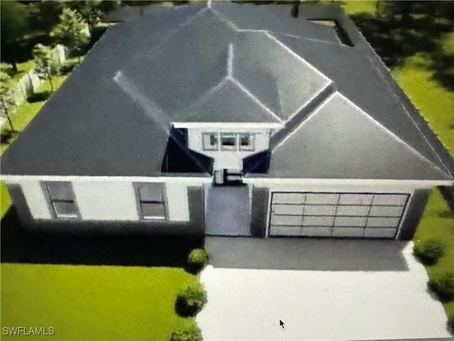 543 Mcarthur Blvd, Lehigh Acres, FL 33974 - view of front of home with a garage