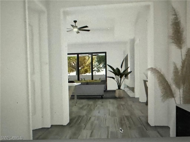543 Mcarthur Blvd, Lehigh Acres, FL 33974 - hallway featuring wood finished floors
