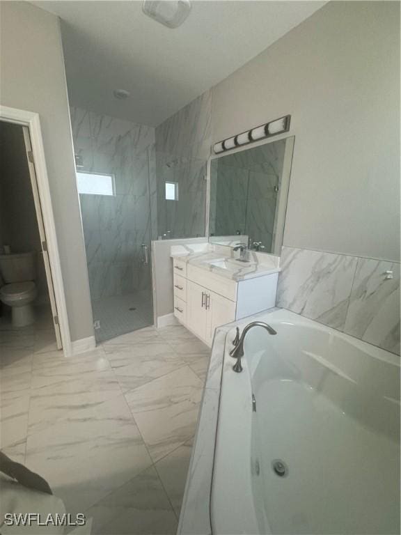 543 Mcarthur Blvd, Lehigh Acres, FL 33974 - bathroom featuring toilet, a marble finish shower, marble finish floors, a whirlpool tub, and vanity