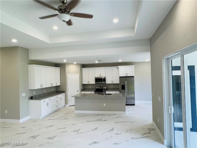 543 Mcarthur Blvd, Lehigh Acres, FL 33974 - kitchen featuring stainless steel appliances, baseboards, light marble finish flooring, recessed lighting, and white cabinetry