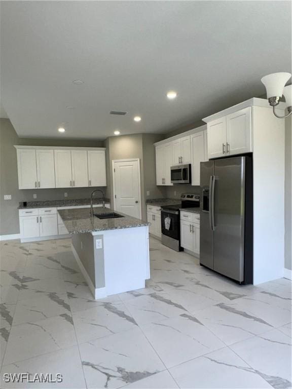 543 Mcarthur Blvd, Lehigh Acres, FL 33974 - kitchen featuring appliances with stainless steel finishes, a sink, baseboards, light marble finish floors, and recessed lighting