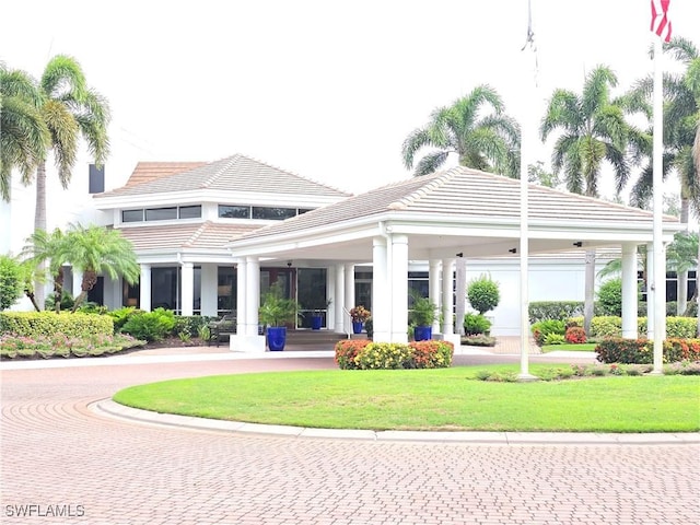 12051 Champions Green Way Unit 322, Fort Myers, FL 33913 - surrounding community with a lawn
