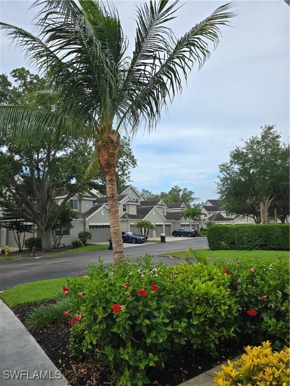 12051 Champions Green Way Unit 322, Fort Myers, FL 33913 - view of yard featuring a residential view