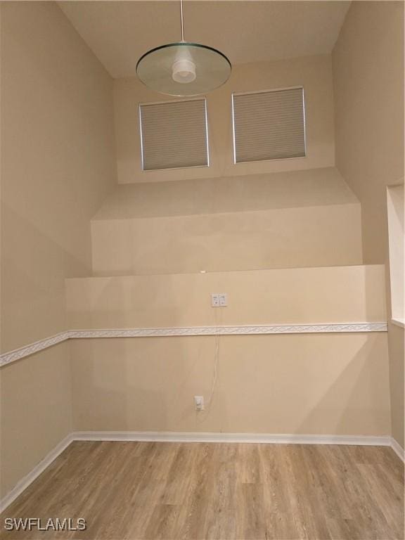 12051 Champions Green Way Unit 322, Fort Myers, FL 33913 - staircase featuring wood finished floors and baseboards