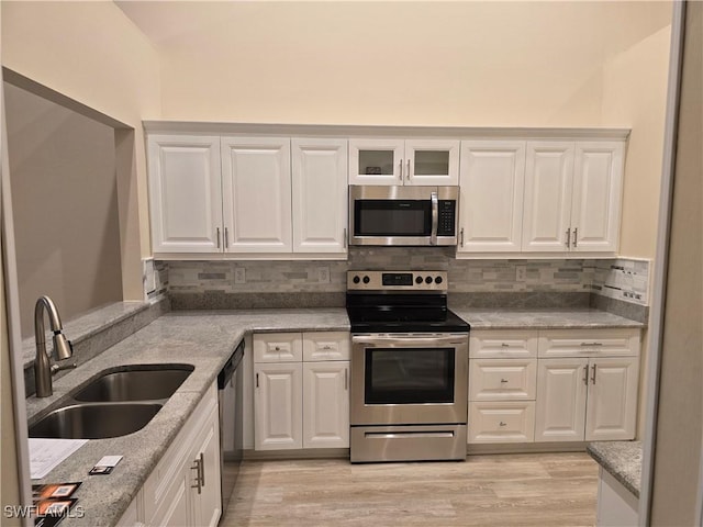 12051 Champions Green Way Unit 322, Fort Myers, FL 33913 - kitchen featuring stainless steel appliances, a sink, and white cabinets