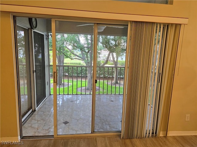 12051 Champions Green Way Unit 322, Fort Myers, FL 33913 - entryway featuring wood finished floors, ceiling fan, and baseboards