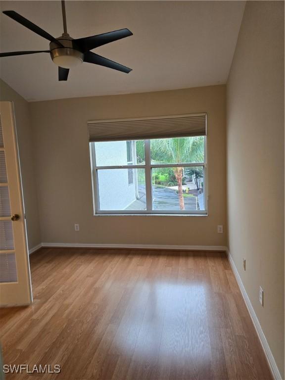 12051 Champions Green Way Unit 322, Fort Myers, FL 33913 - unfurnished room featuring light wood-type flooring, baseboards, and a ceiling fan
