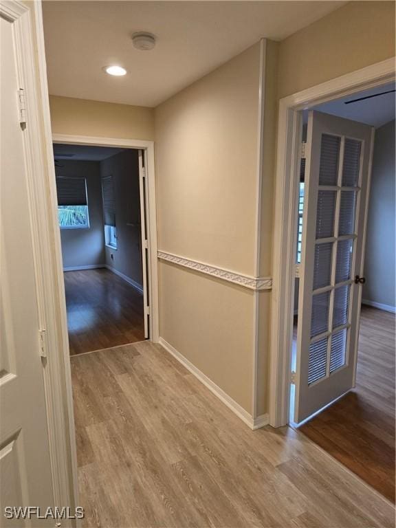 12051 Champions Green Way Unit 322, Fort Myers, FL 33913 - hall with wood finished floors, baseboards, and recessed lighting