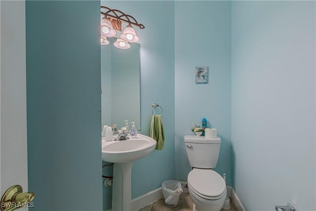 bathroom with tile patterned flooring and toilet