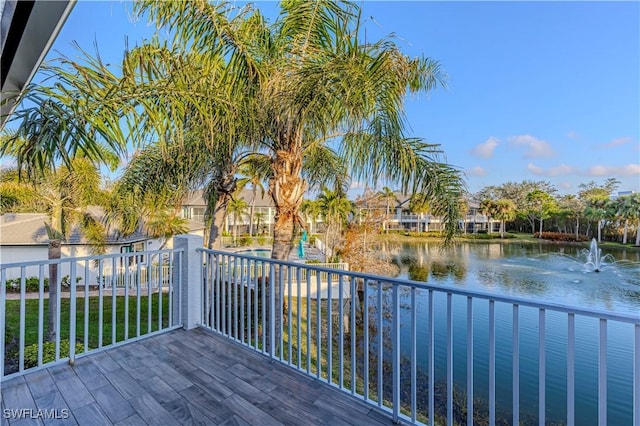 wooden deck with a water view