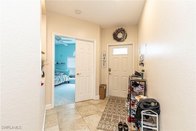 foyer featuring light tile patterned floors