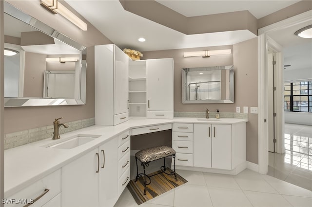 bathroom featuring tile patterned floors and vanity