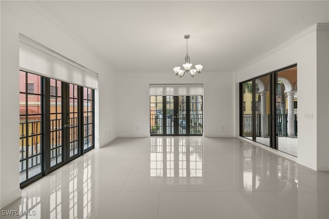 unfurnished room featuring light tile patterned flooring, a chandelier, crown molding, and french doors