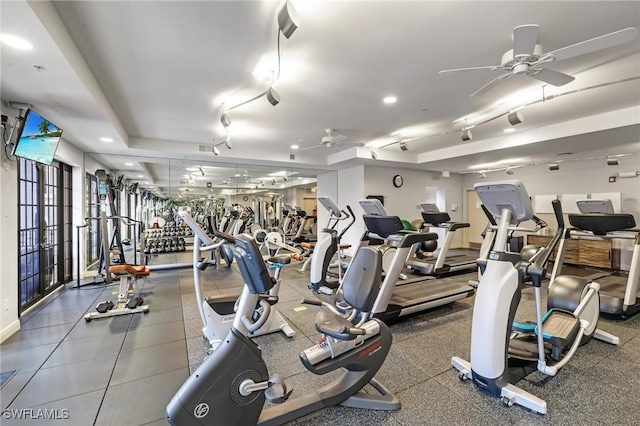 workout area featuring ceiling fan and track lighting