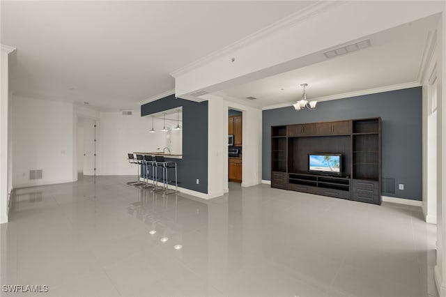 unfurnished living room featuring tile patterned floors, ornamental molding, and a notable chandelier