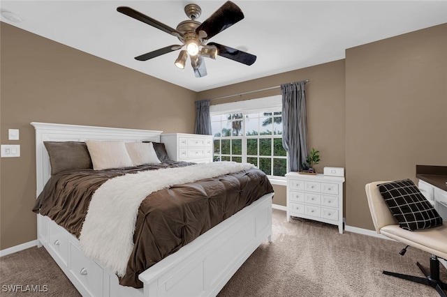 bedroom with dark carpet and ceiling fan