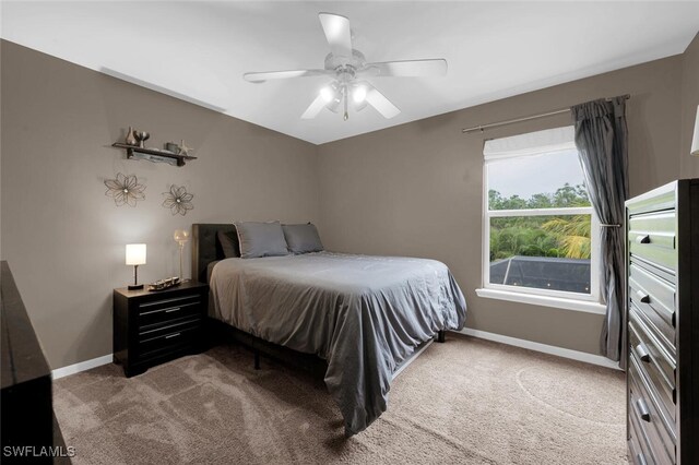 bedroom with ceiling fan and carpet flooring