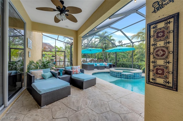 view of swimming pool featuring a patio, an in ground hot tub, a lanai, an outdoor hangout area, and ceiling fan