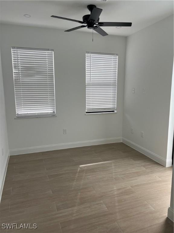 unfurnished room with wood-type flooring and ceiling fan