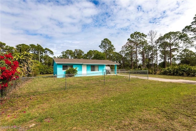 ranch-style house with a front lawn