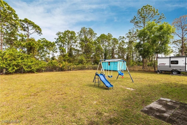 view of playground featuring a lawn