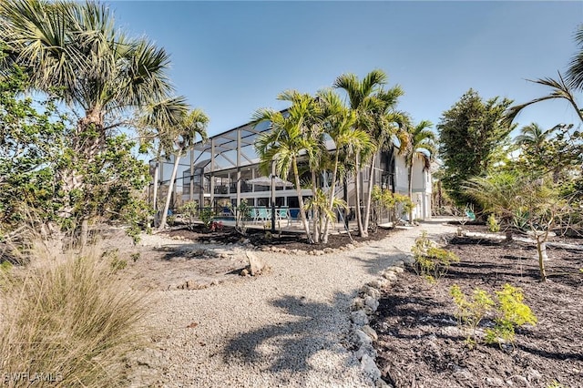 3025 Turtle Gait Ln, Sanibel, FL 33957 - exterior space featuring a lanai and an outdoor pool