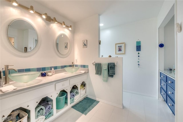 3025 Turtle Gait Ln, Sanibel, FL 33957 - full bath featuring tile patterned flooring, double vanity, baseboards, and a sink