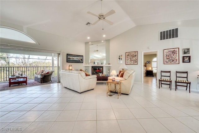 3025 Turtle Gait Ln, Sanibel, FL 33957 - living area with visible vents, high vaulted ceiling, a ceiling fan, and light tile patterned floors