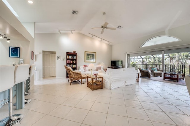 3025 Turtle Gait Ln, Sanibel, FL 33957 - living room featuring track lighting, a healthy amount of sunlight, light tile patterned floors, and ceiling fan