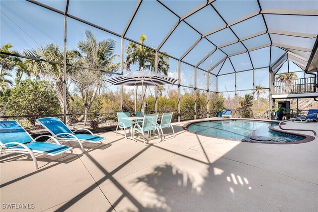3025 Turtle Gait Ln, Sanibel, FL 33957 - pool featuring glass enclosure and a patio