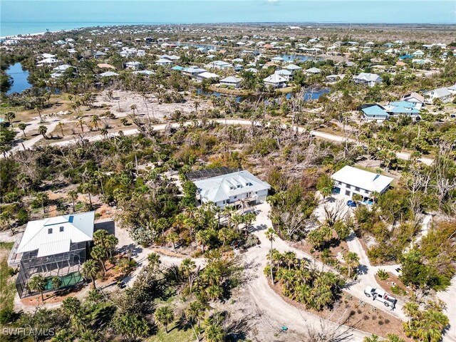 3025 Turtle Gait Ln, Sanibel, FL 33957 - aerial view with a water view and a residential view