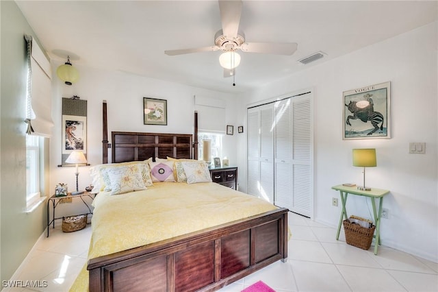 3025 Turtle Gait Ln, Sanibel, FL 33957 - bedroom with a closet, visible vents, multiple windows, and light tile patterned flooring