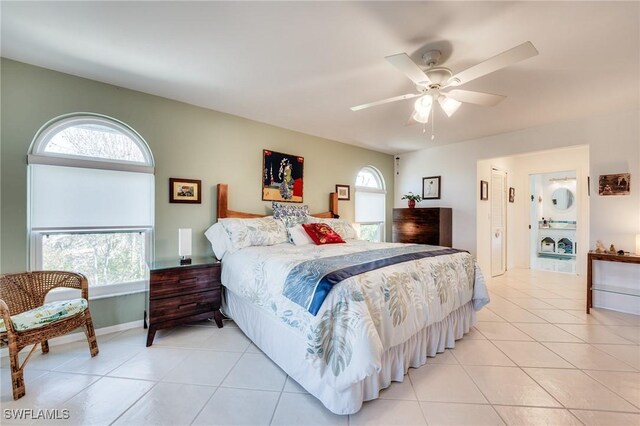 3025 Turtle Gait Ln, Sanibel, FL 33957 - bedroom with light tile patterned floors, multiple windows, and a ceiling fan