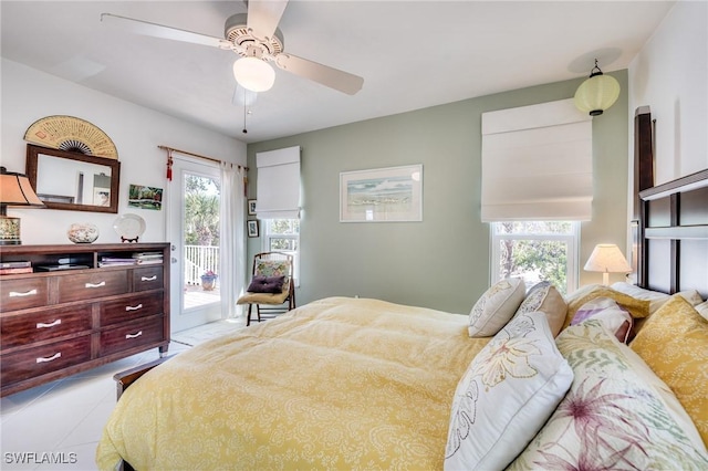 3025 Turtle Gait Ln, Sanibel, FL 33957 - tiled bedroom featuring access to outside and ceiling fan