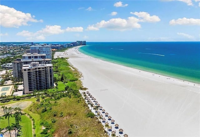 birds eye view of property with a view of the beach and a water view