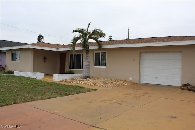 ranch-style home with a garage and a front yard