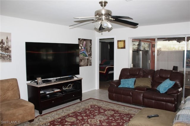 tiled living room with ceiling fan