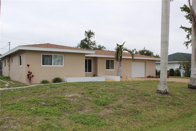 single story home with a garage and a front yard