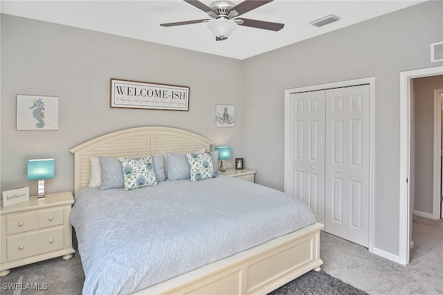 carpeted bedroom with ceiling fan and a closet