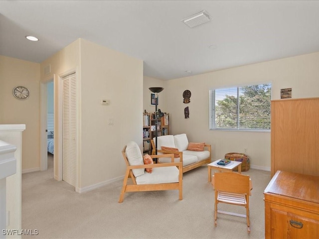 living room with light colored carpet