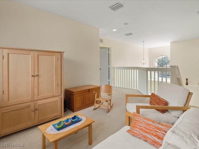 living area with light colored carpet